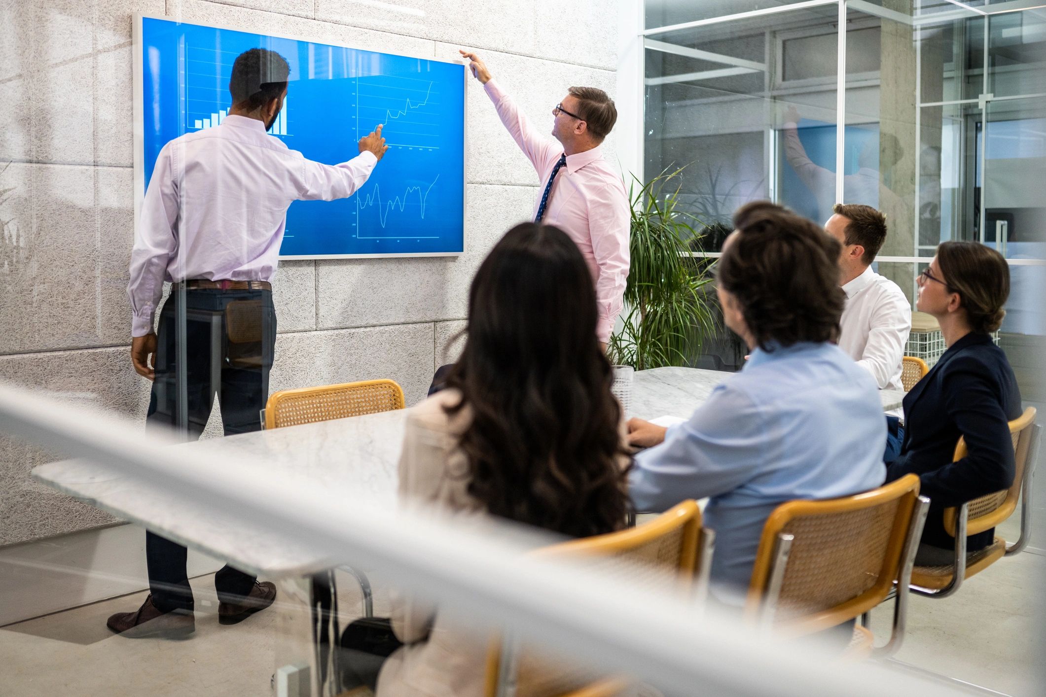 Project management meeting with presentation in conference room
