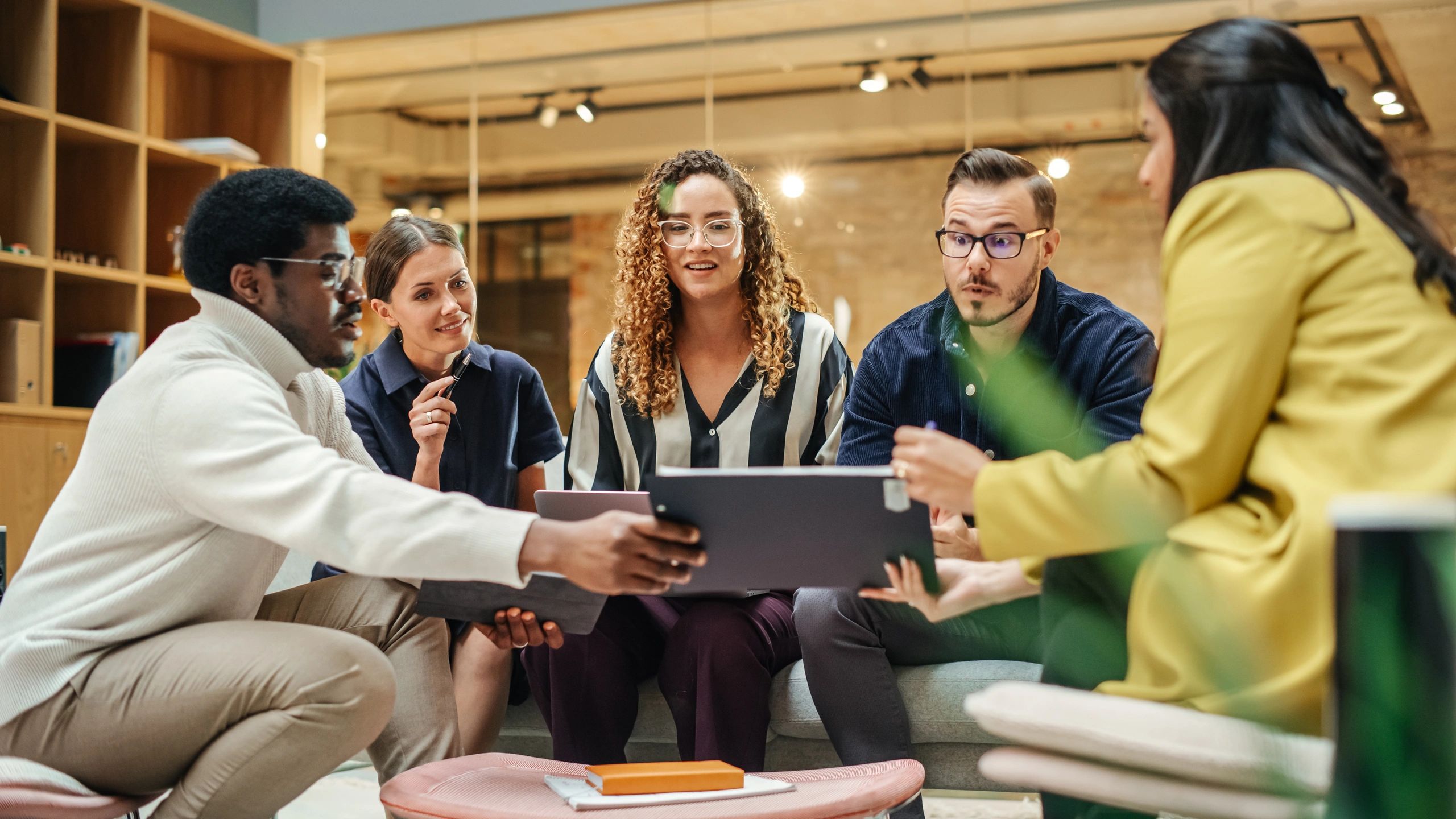 Creative digital agency team collaborating in a modern office