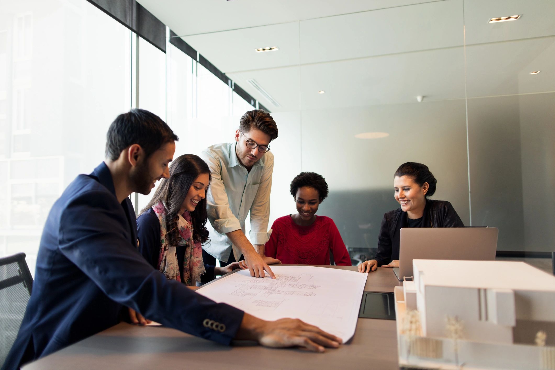 Professionals reviewing plans together at a strategy workshop